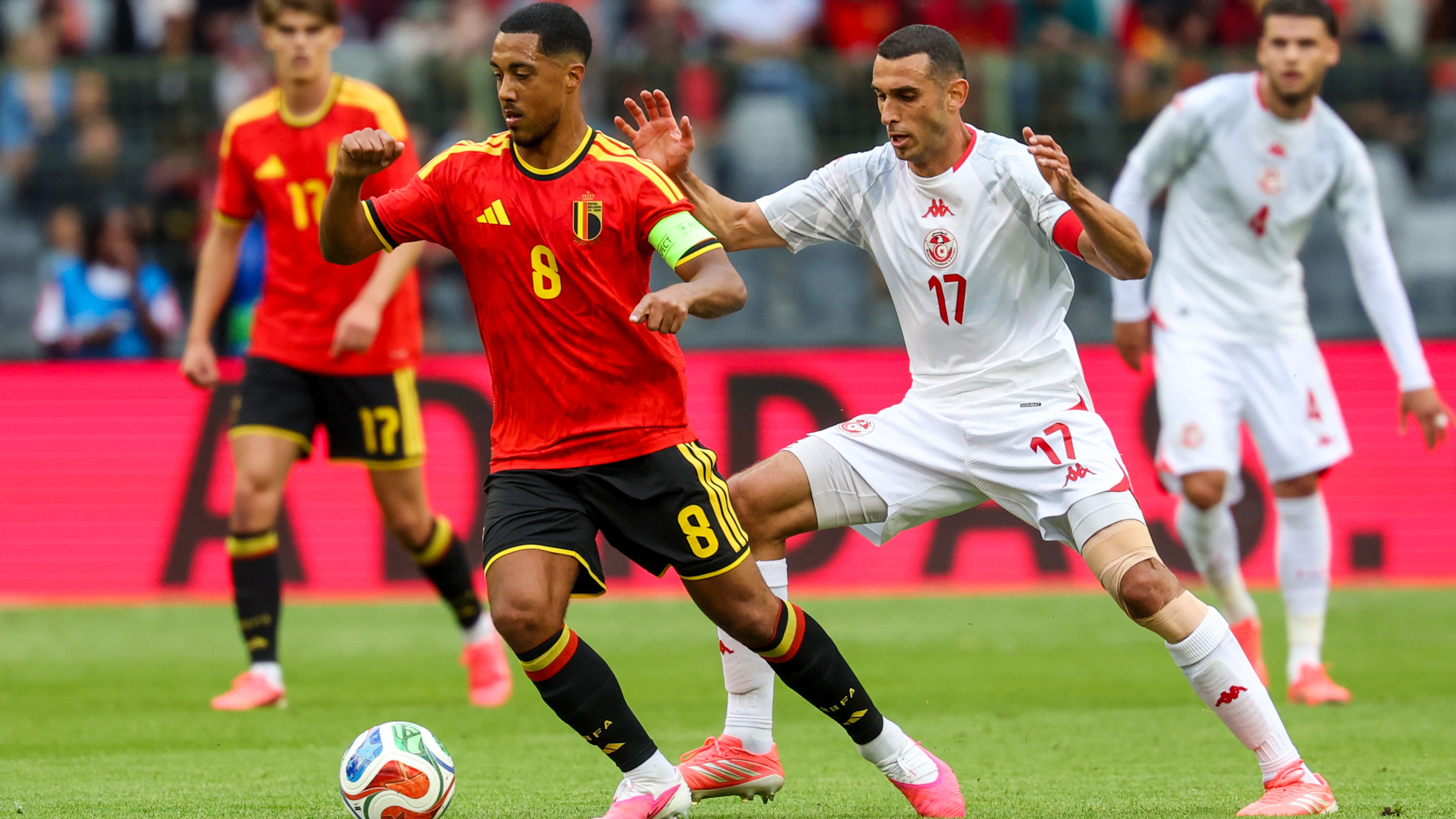 Belgium's Youri Tielemans and Tunisian Ellyes Skhiri fight for the ball