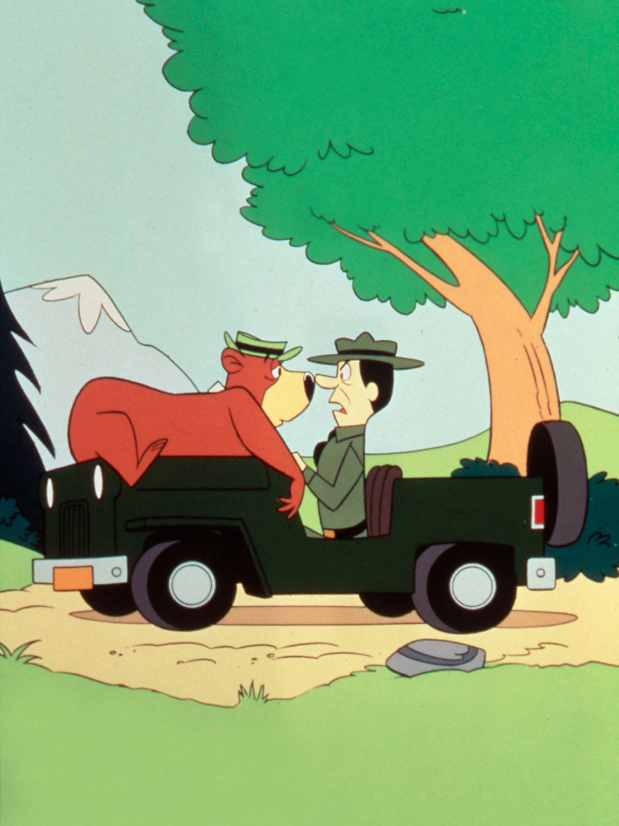 Yogi Bear on the hood of the park ranger's Jeep.