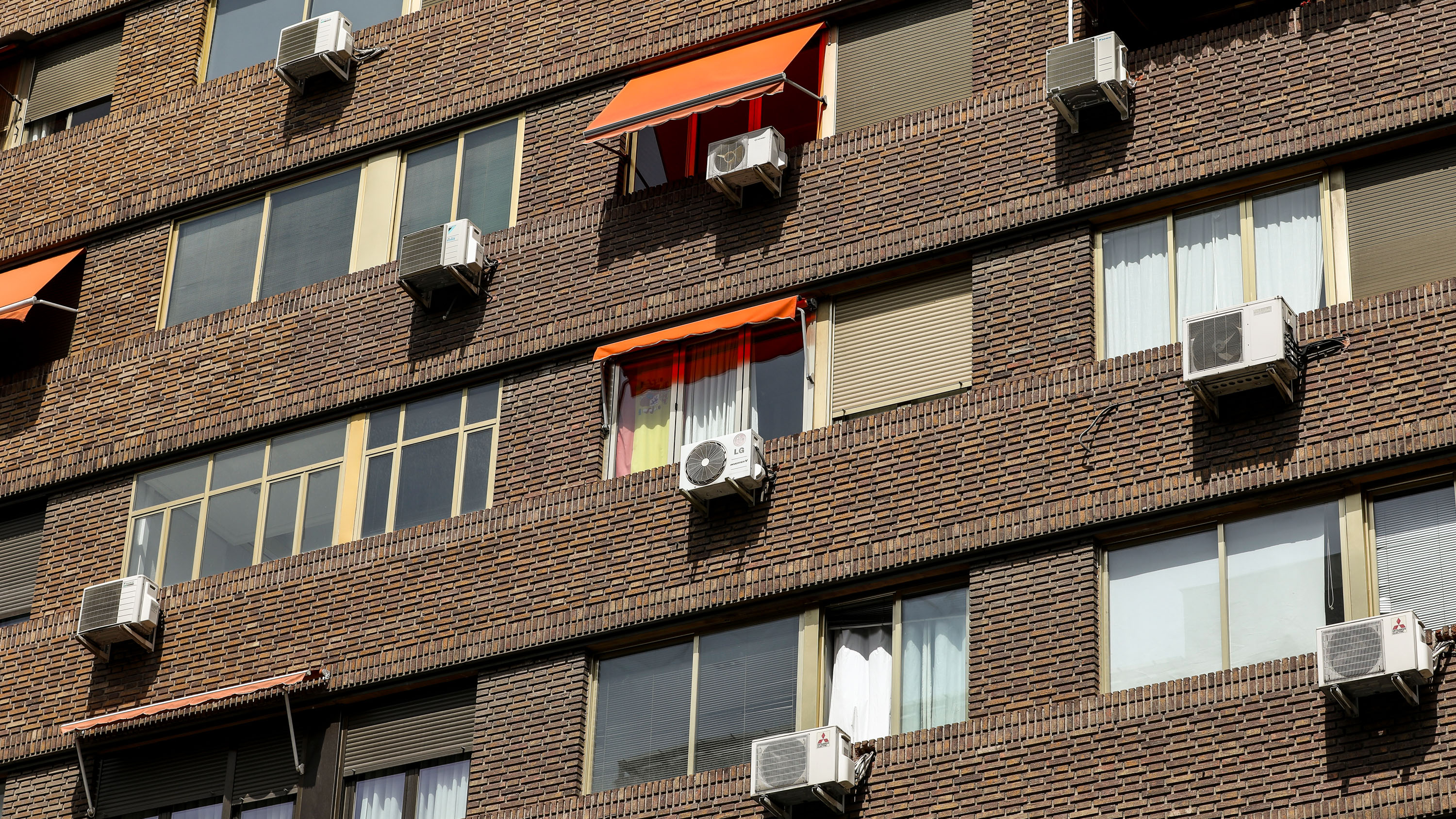 Air-conditioning units on the exterior of apartment building