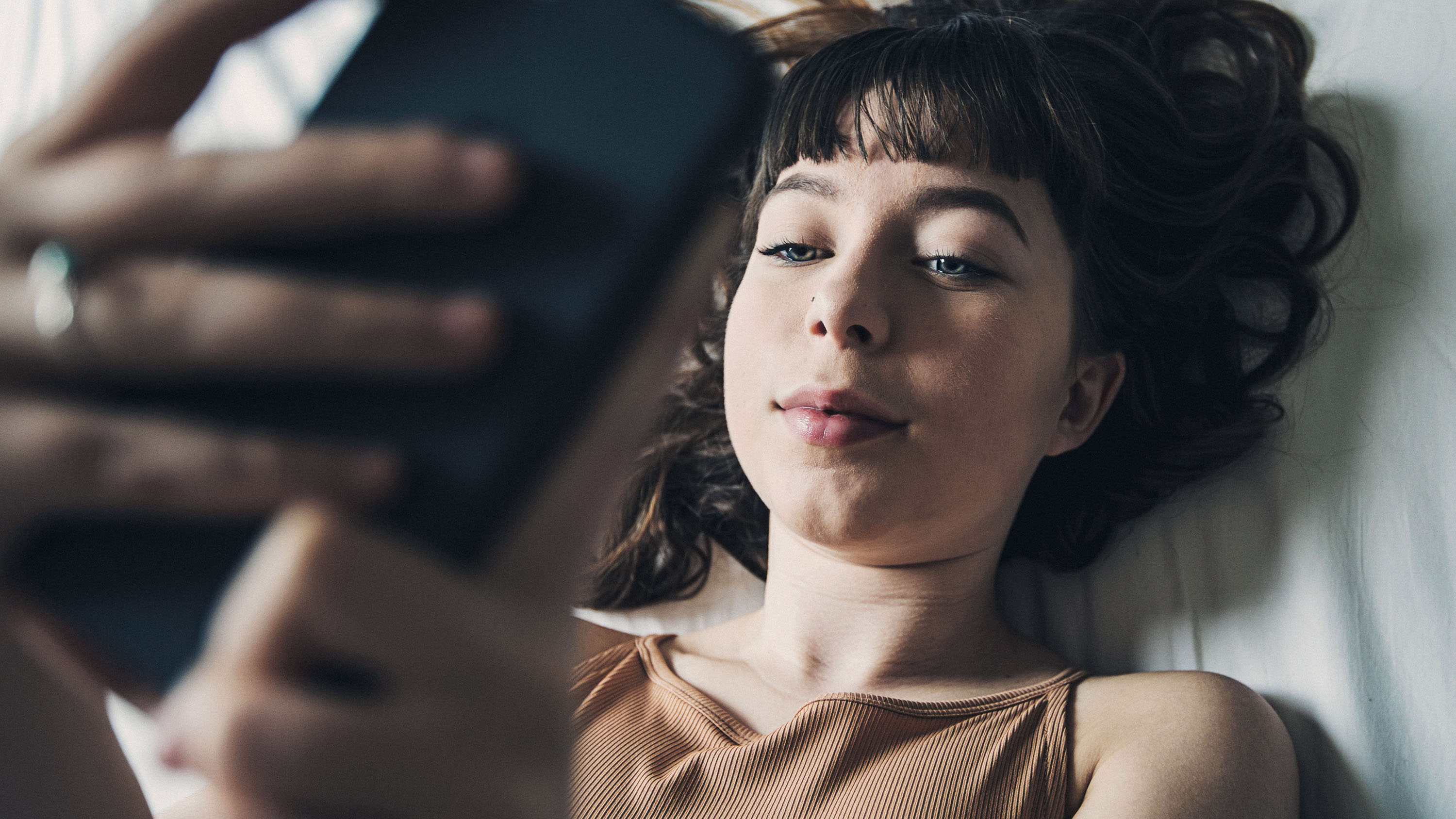 Looking down at a teenage Girl on Smartphone